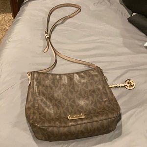 Micheal Kors side bag has wear on strap